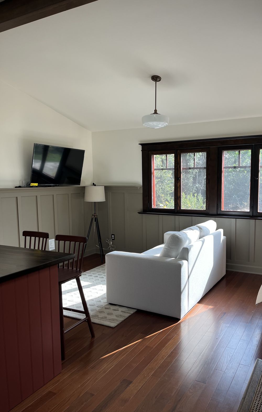 Living area of a completed Craftsman ADU with board-and-batten wainscot